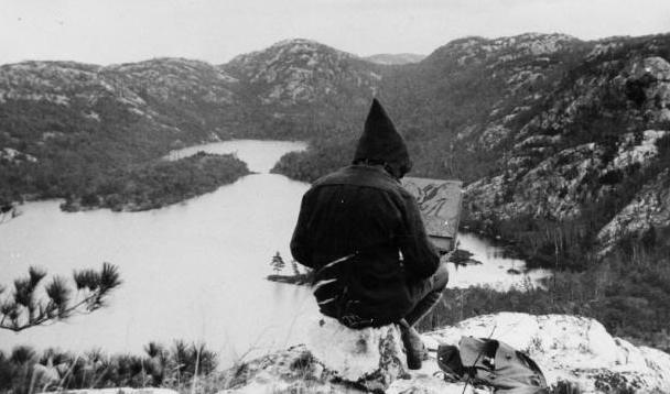 Group of Seven artist Franklin Carmichael sketching outdoors.